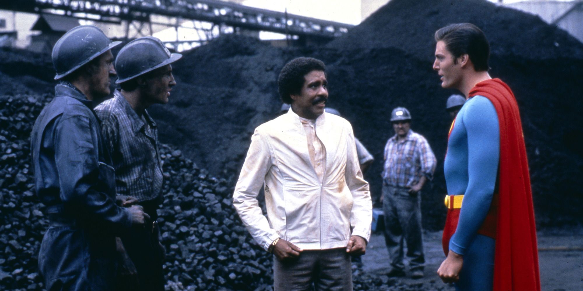 Christopher Reeve and Richard Pryor in 'Superman III' outside an industrial factory