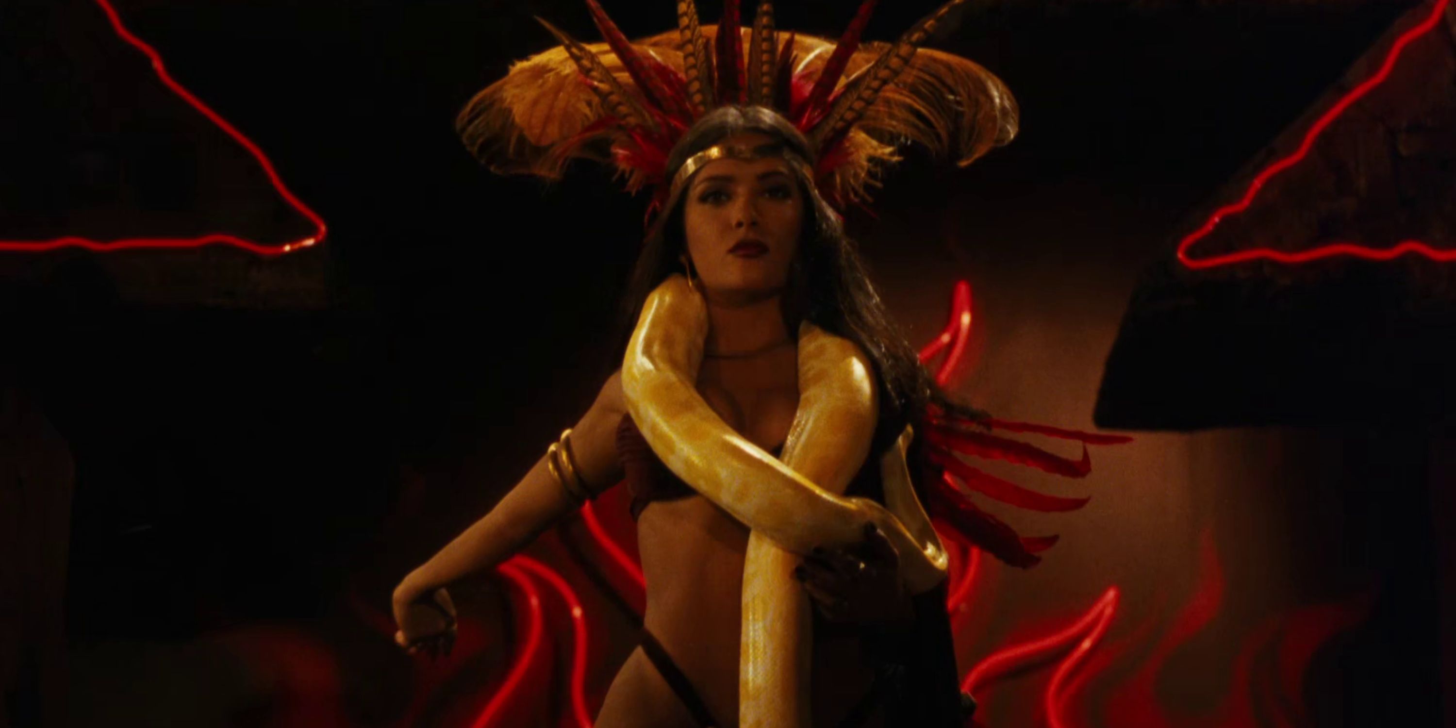 Salma Hayek as Santanico Pandemonium, a woman in a bikini with a python snake on her shoulders in 'From Dusk Till Dawn'