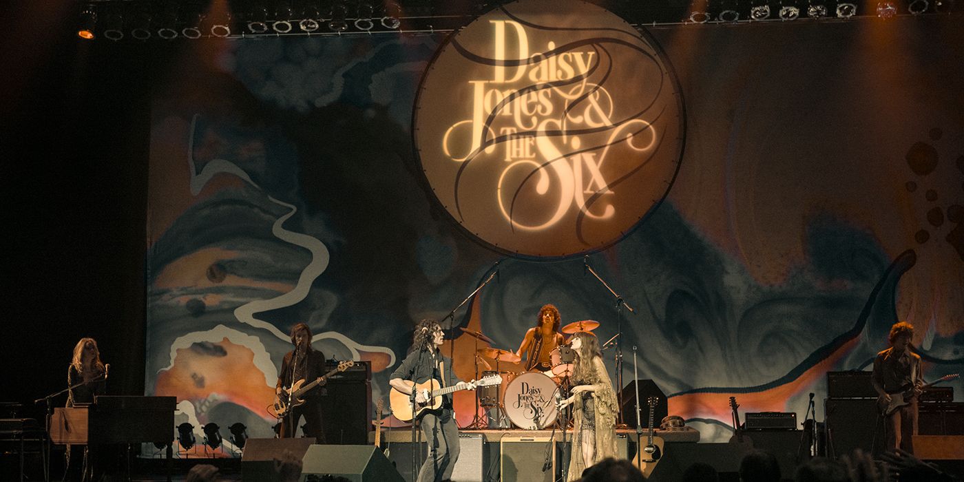 Sam Claflin and Riley Keough sing with the band on stage in Daisy Jones and Six Episode 8.
