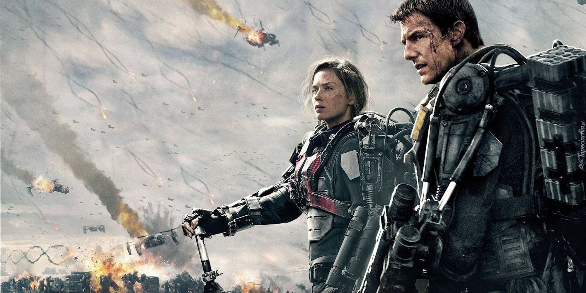 Emily Blunt and Tom Cruise looking to the distance in a poster for Edge of Tomorrow.
