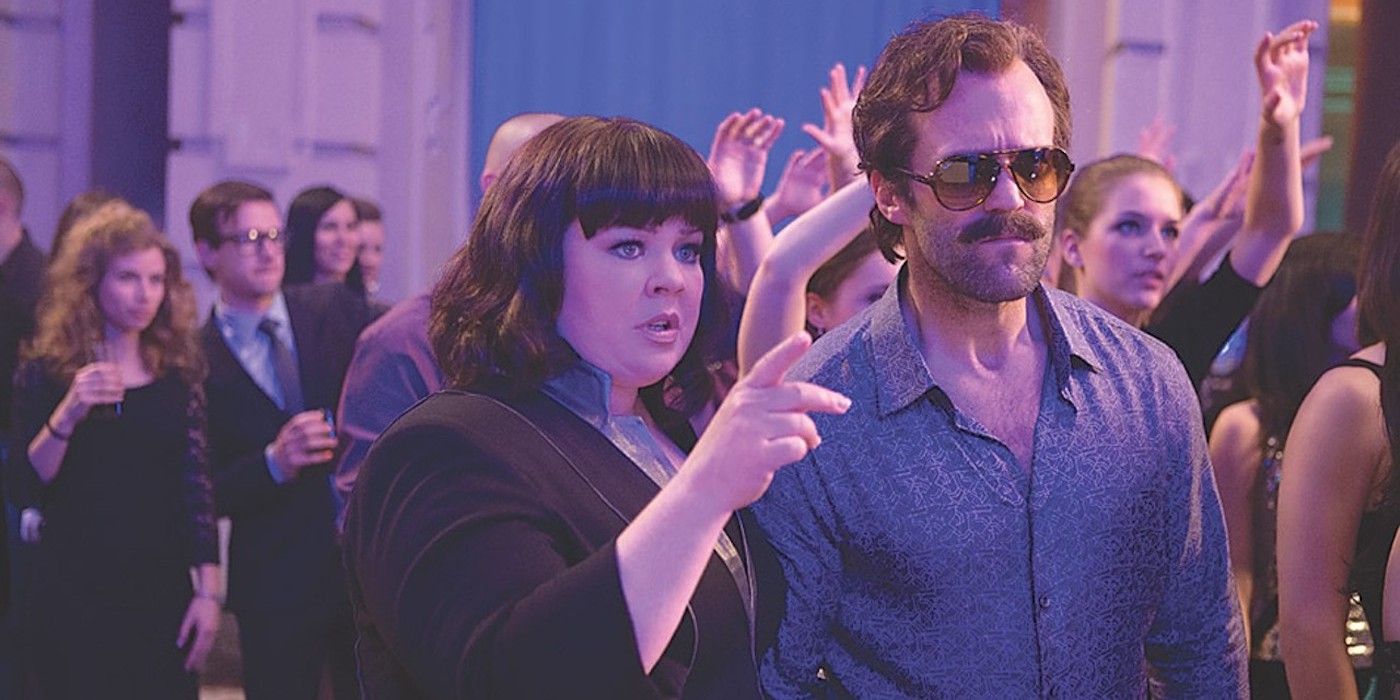 Jason Statham as Rick Ford and Melissa McCarthy Susan Cooper at a club in Spy
