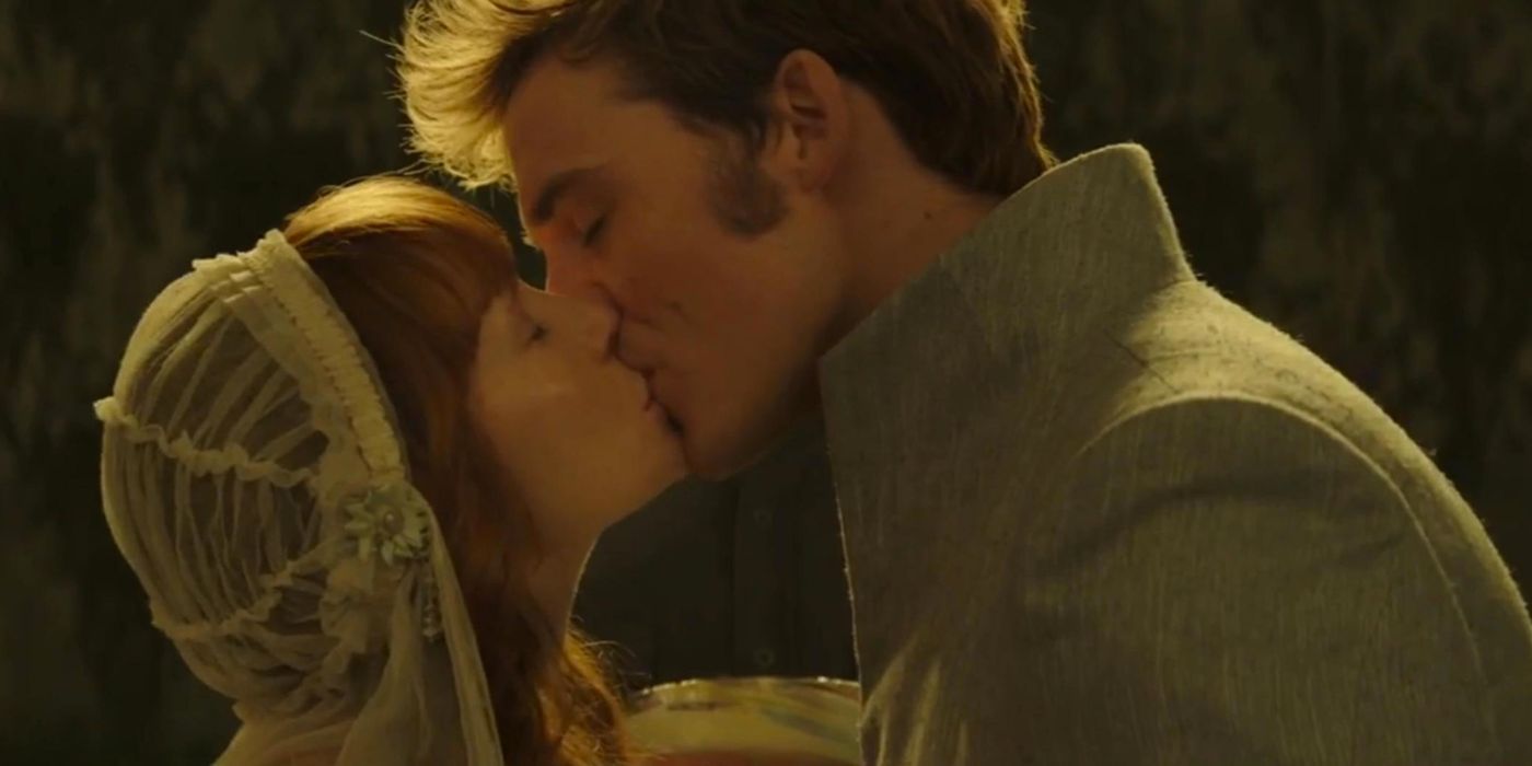 Sam Claflin as Finnick and Stef Dawson as Annie kiss at their wedding in The Hunger Games: Mockingjay Part 2