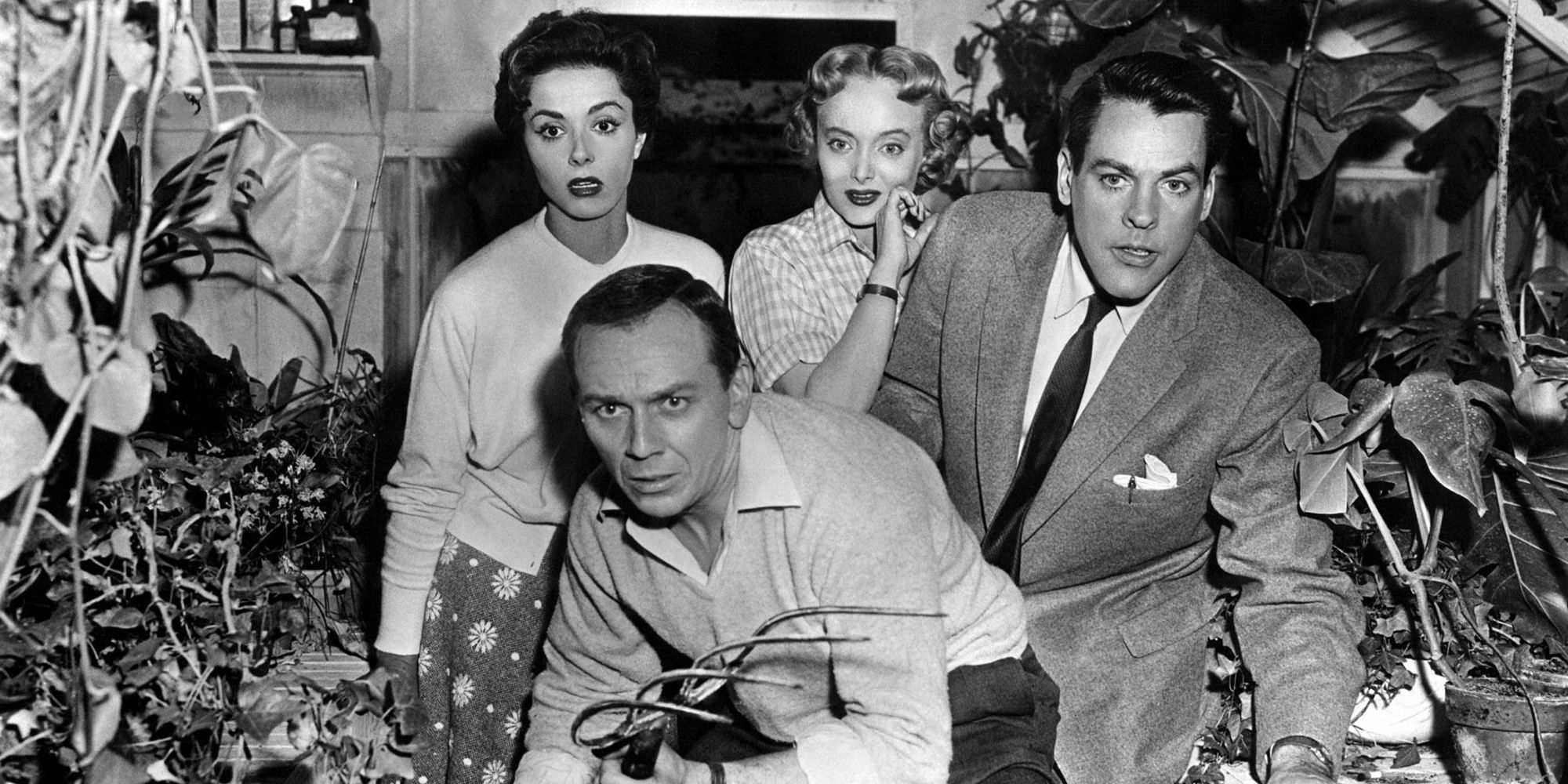 A group of characters looking curiously at something off-camera in Invasion of the Body Snatchers