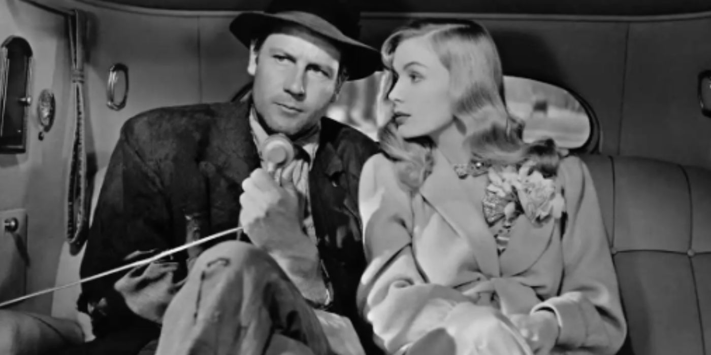 Joel McCrea sitting in the backseat of a car with Veronica Lake in Sullivan's Travels