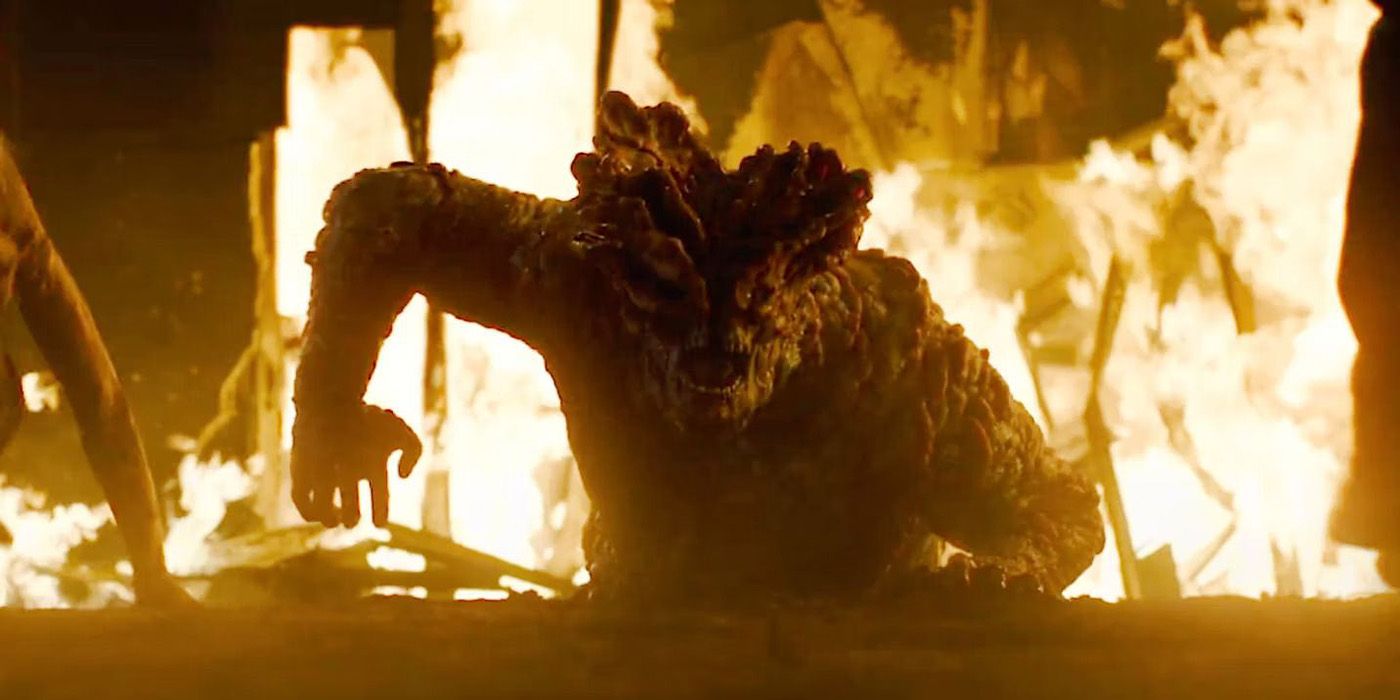 The Bloater climbing out of the ground surrounded by fire in The Last of Us Episode 5