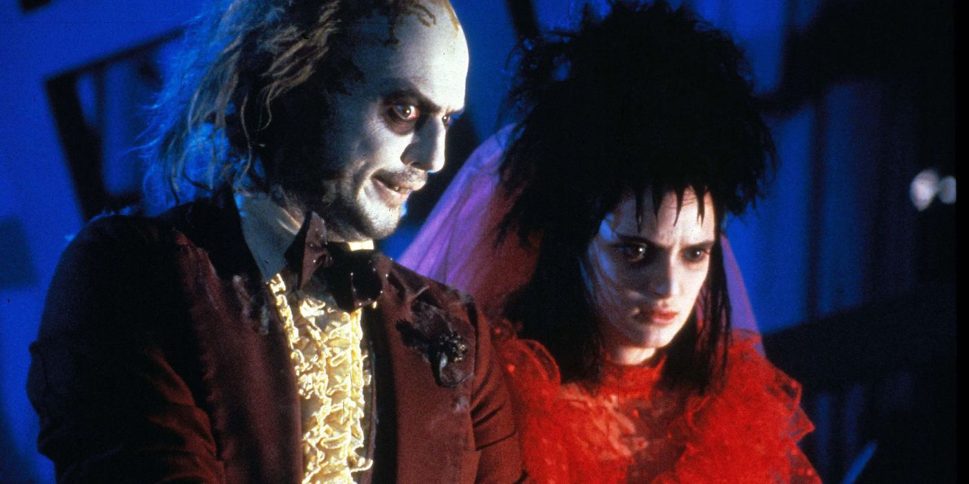 Michael Keaton dans le rôle de Beetlejuice et Winona Ryder dans le rôle de Lydia dans Beetlejuice.