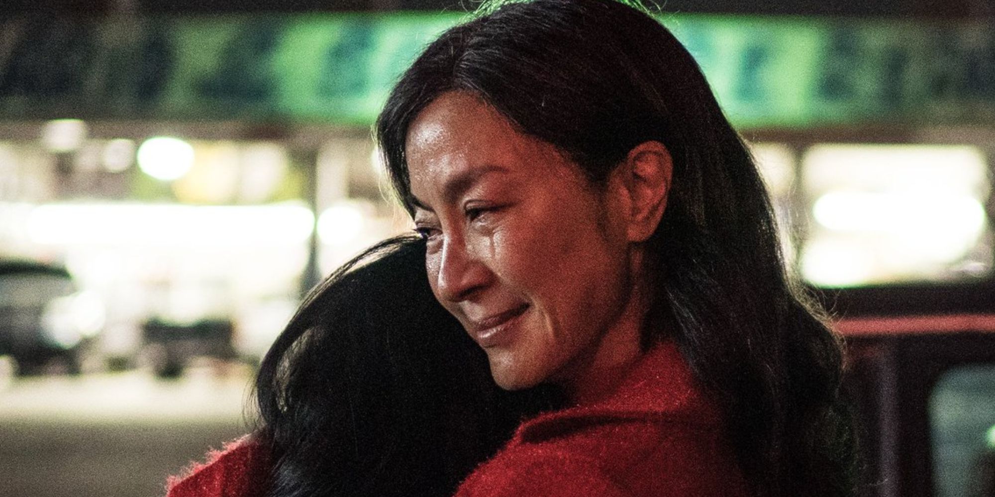 Michelle Yeoh holding Stephanie Hsu in her arms in Everything Everywhere All at Once