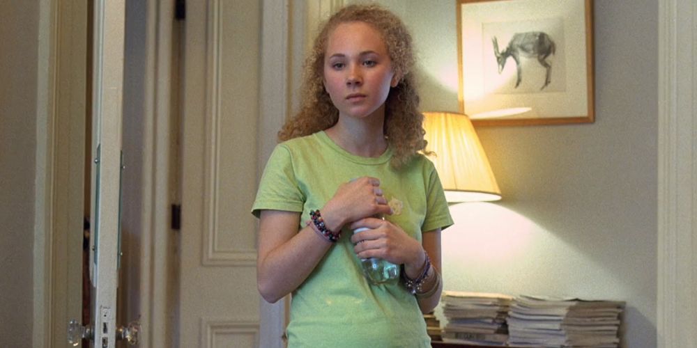 An official screenshot of Juno Temple holding a bottle in Notes on a Scandal (2006)