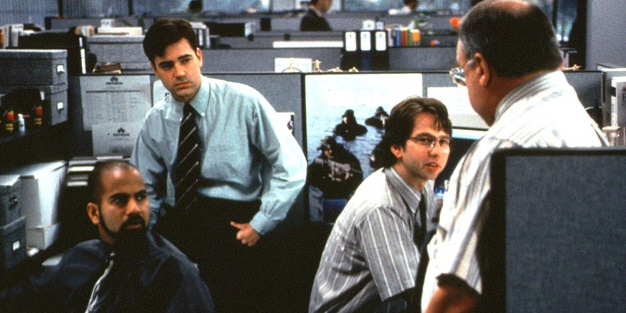 Ron Livingston as Peter Gibbons with his co-workers in the film 'Office Space' (1999)