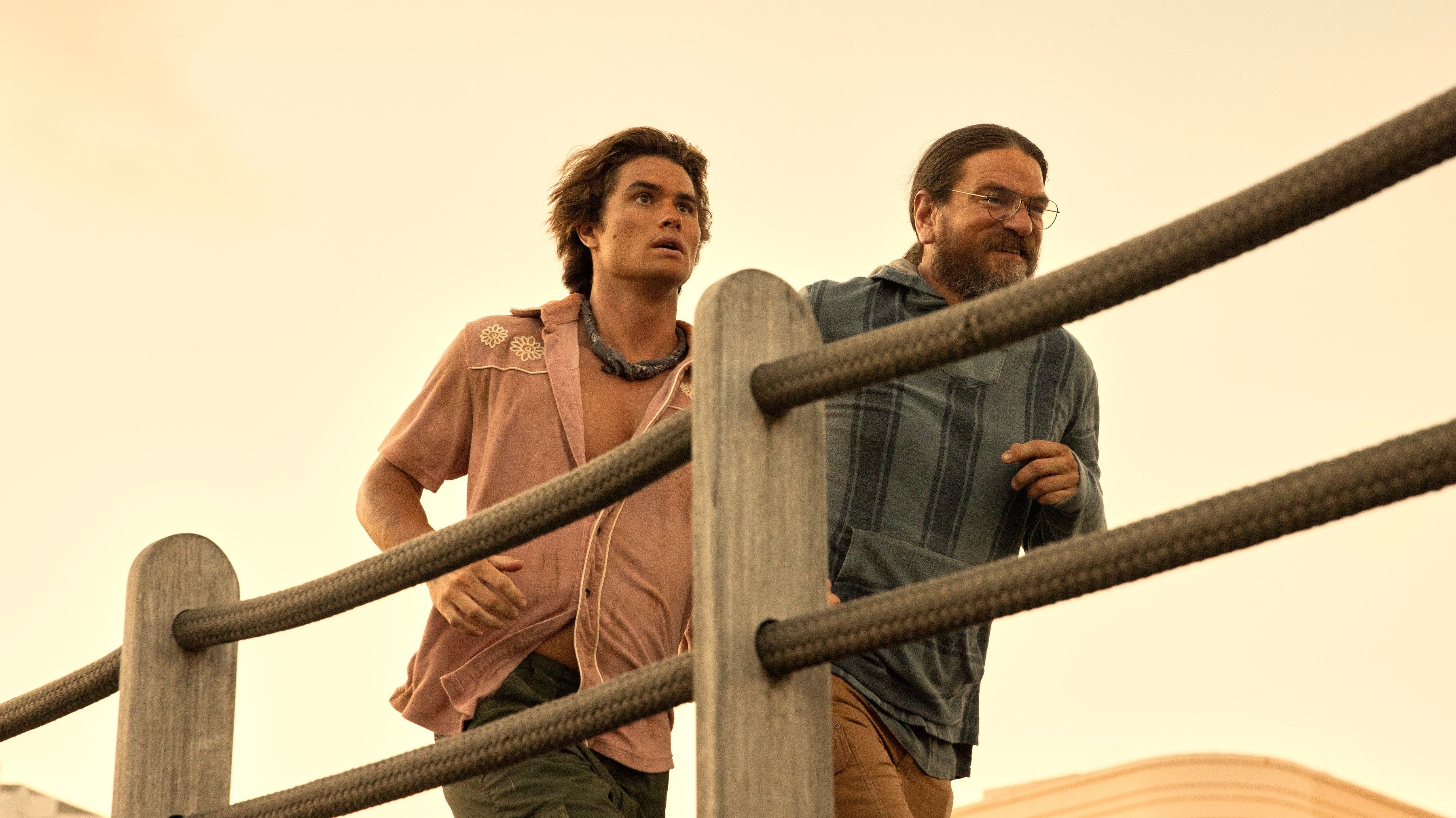 Chase Stokes as John B and Charles Halford as Big John on the run in Episode 303 of Outer Banks. 