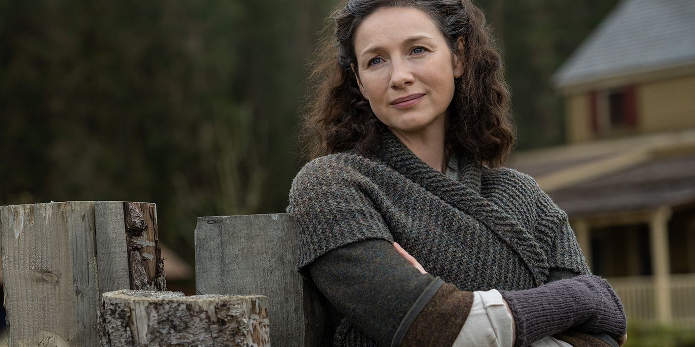 Claire Fraser, played by Caitriona Balfe, wearing a grey dress and shawl in 'Outlander.'