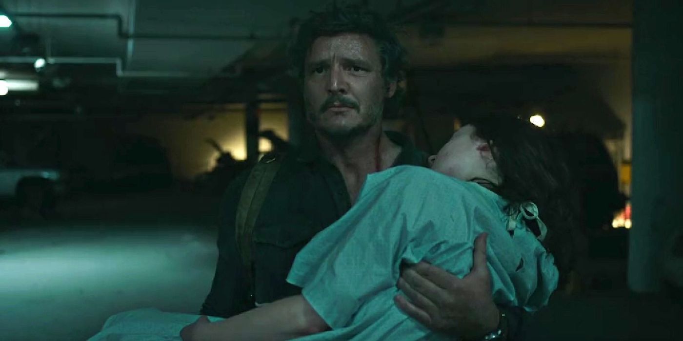 Joel, played by Pedro Pascal, carrying Ellie, played by Bella Ramsey, in her hospital gown in Episode 9 of The Last of Us