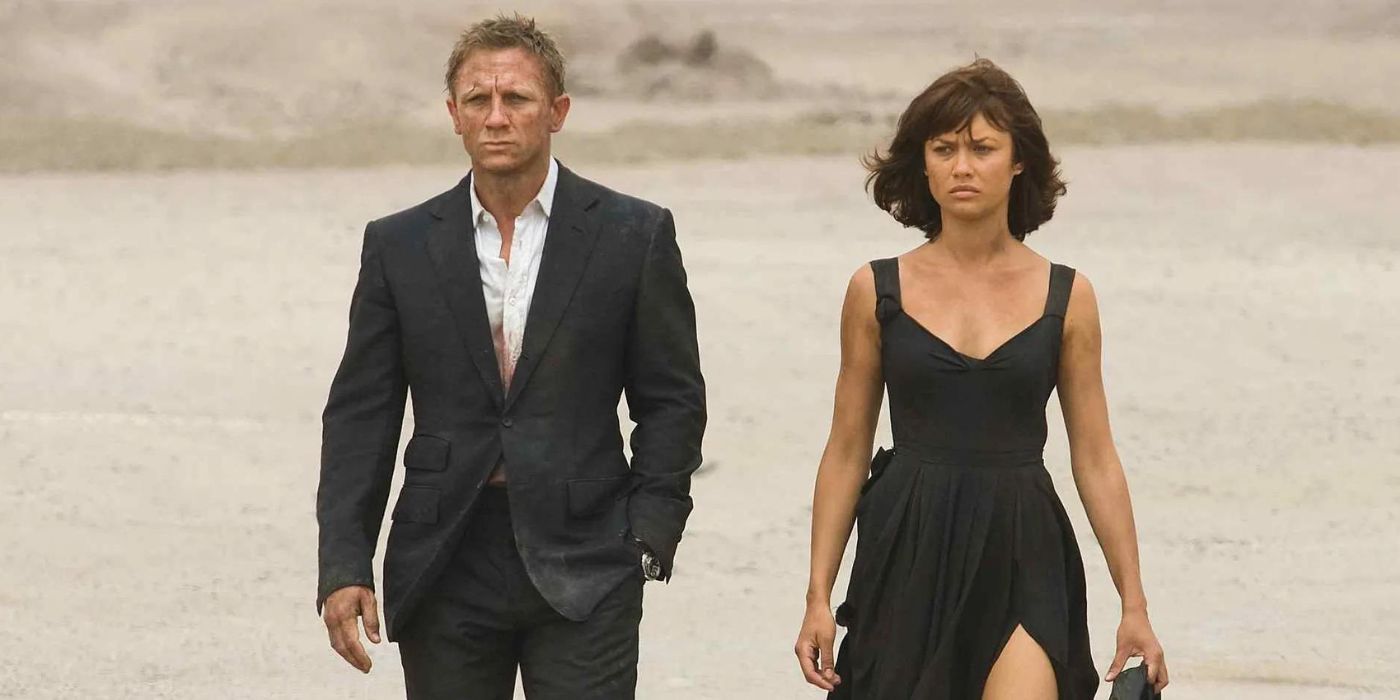 Daniel Craig as James Bond and Olga Kurylenko as Camille walking in the desert in 'Quantum of Solace'