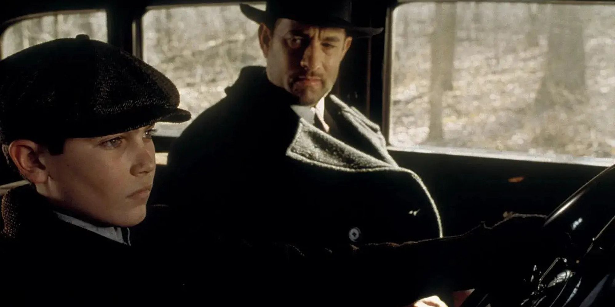 Tyler Hoechlin and Tom Hanks in a car in Road to Perdition