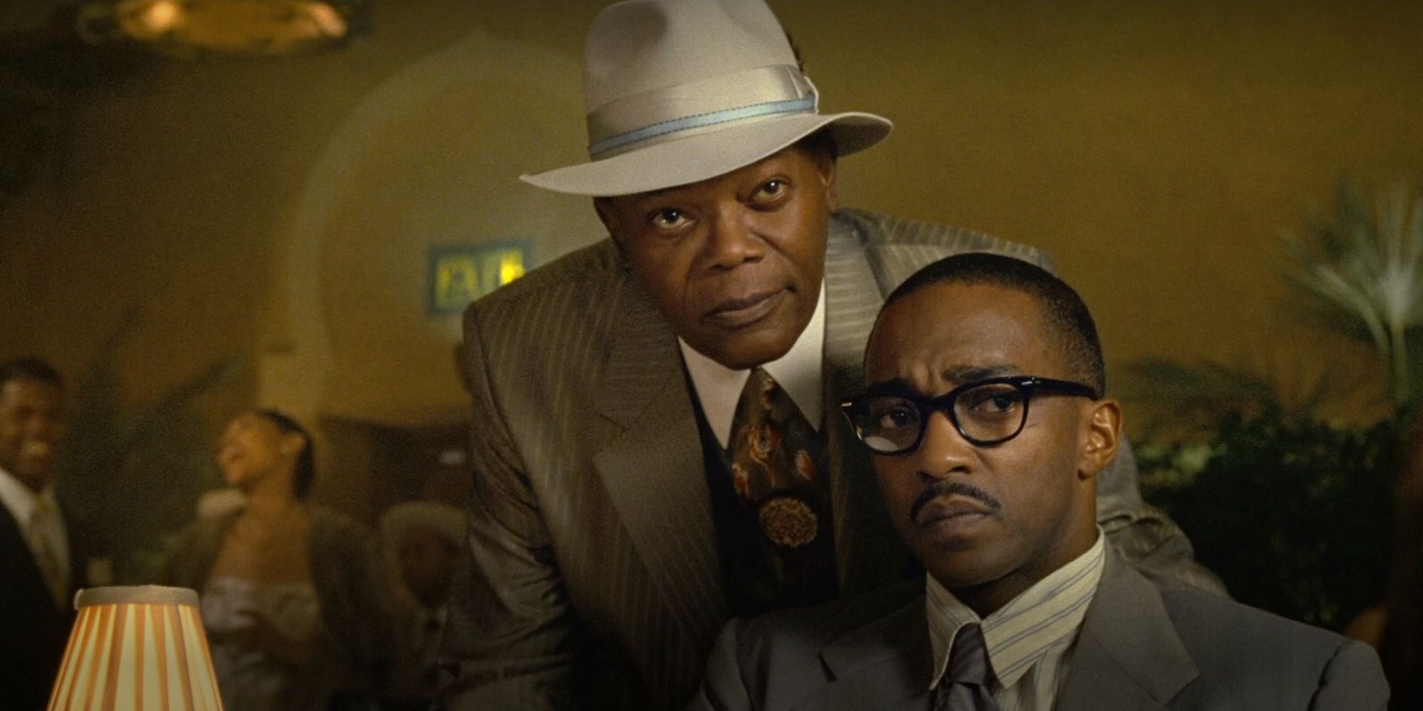 Samuel L. Jackson and Anthony Mackie in 'The Banker', sitting at a cafe with period clothes