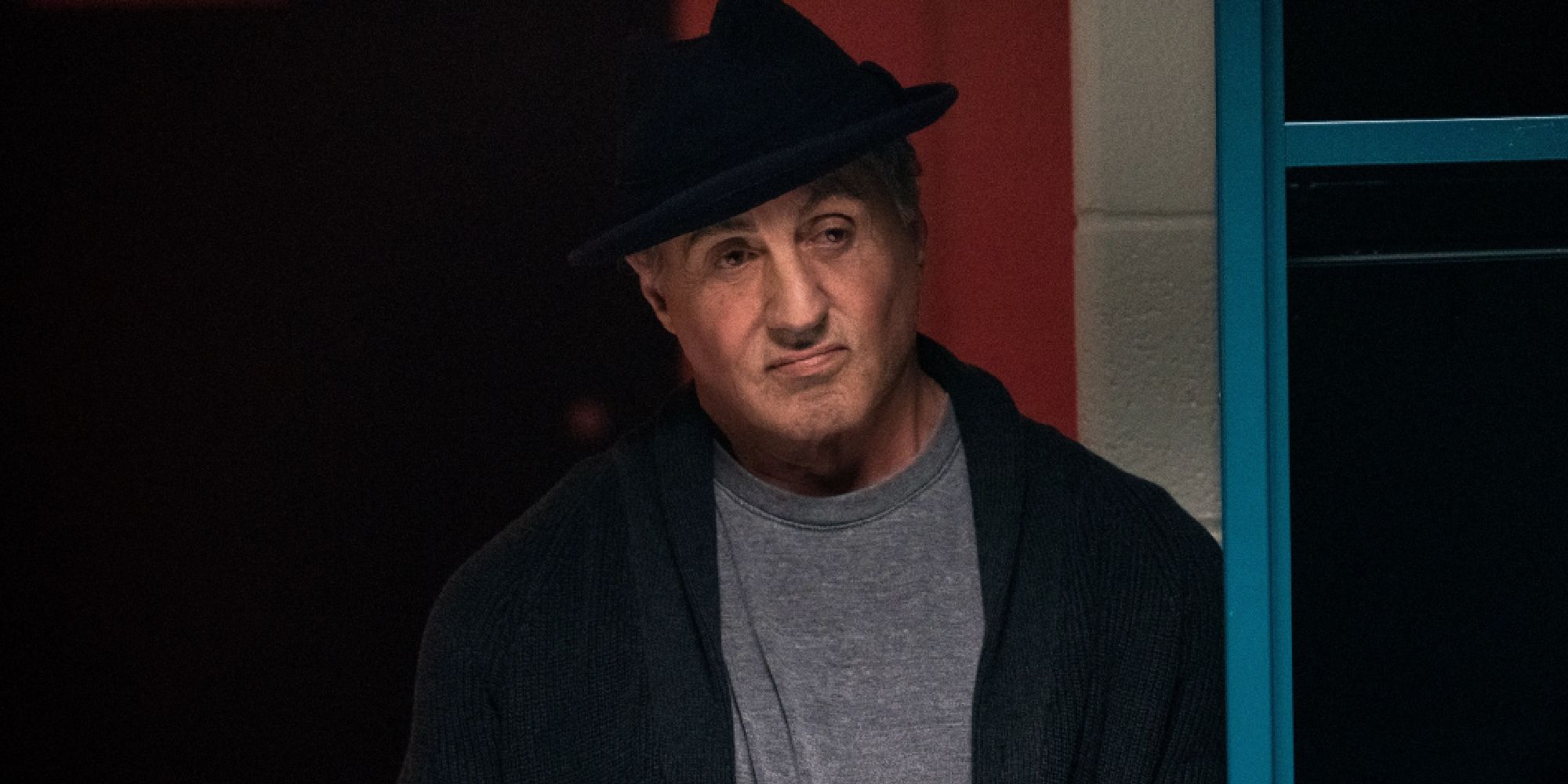 Rocky Balboa (Sylvester Stallone) watches Creed practice boxing in 'Creed II'
