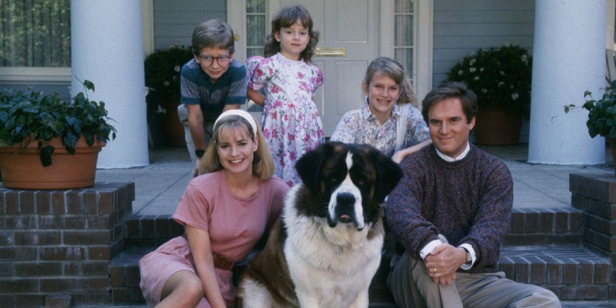 The cast of Beethoven with the Beethoven dog