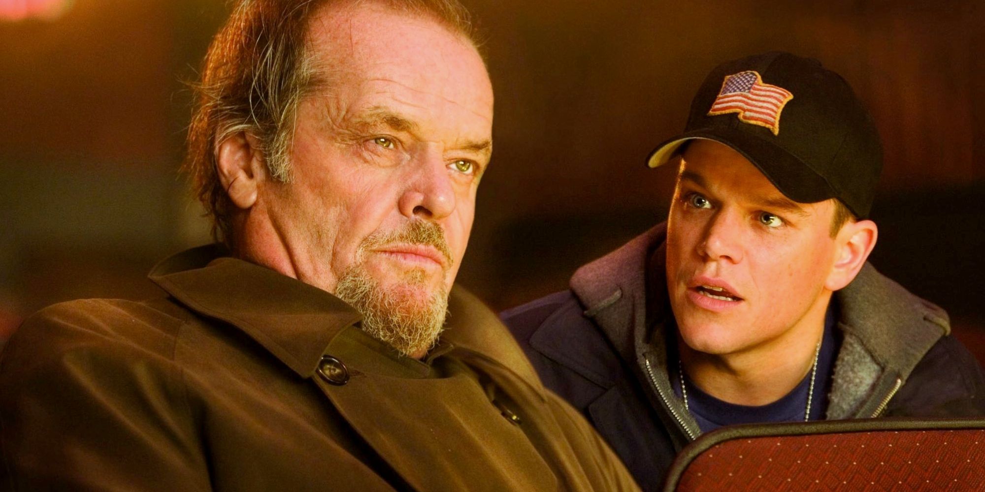 Matt Damon as Colin Sullivan talking to Jack Nicholson as Frank Costello in a movie theater in The Departed