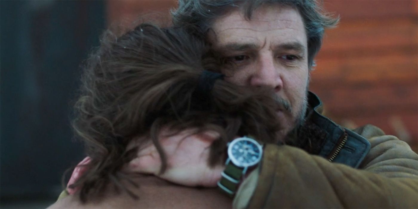 Pedro Pascal as Joel hugging Ellie with Sarah's watch on in The Last of Us