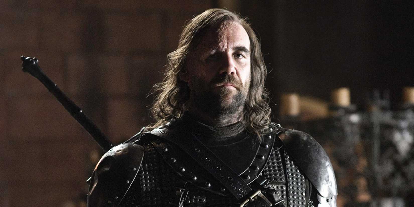 Rory McCann as Sandor "The Hound" Clegane standing solemn in HBO's Game of Thrones.