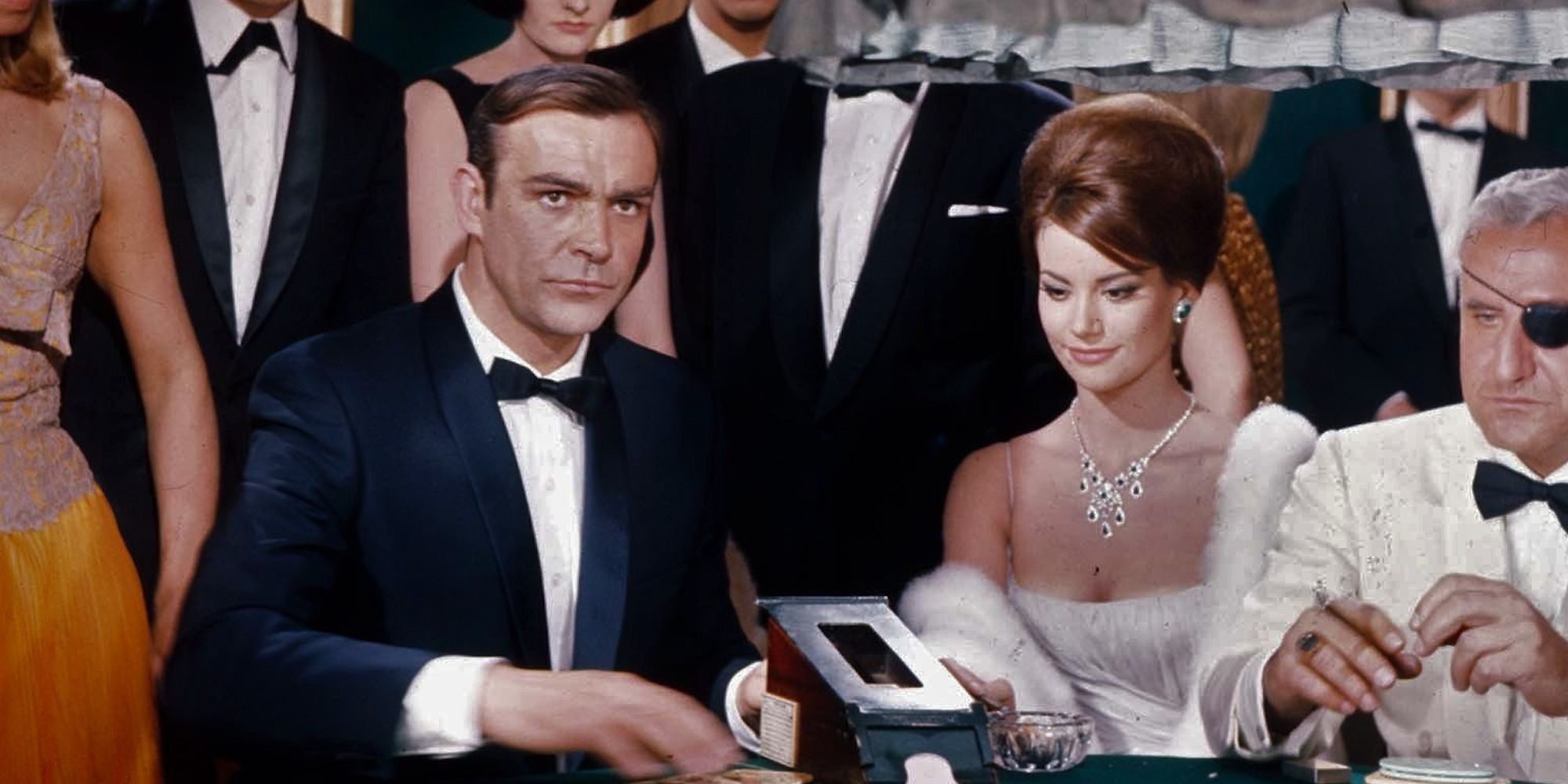 Sean Connery as James Bond in a gambling table surrounded by guests in 'Thunderball'