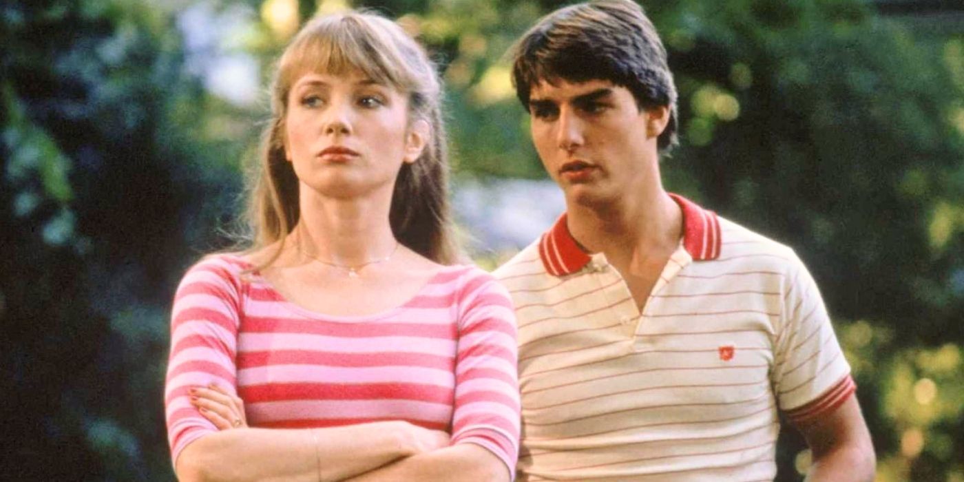 Tom Cruise standing close behind Rebecca De Mornay in Risky Business