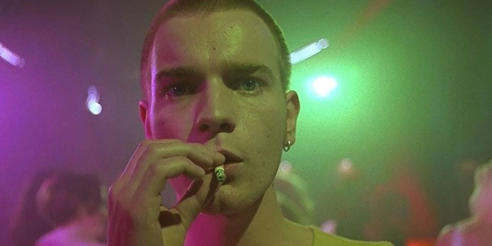 Ewan McGregor as Mark Renton, smoking a cigarette at a nightclub in 'Trainspotting'