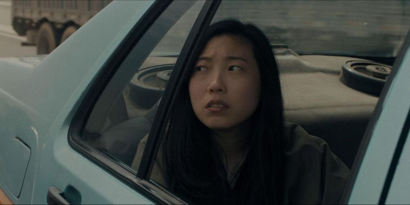 Awkwafina in a car during a scene from The Farewell. 