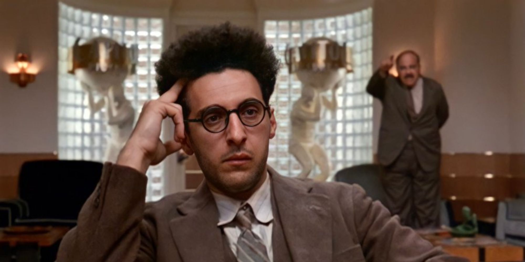 Barton Fink looking pensive and annoyed in Barton Fink