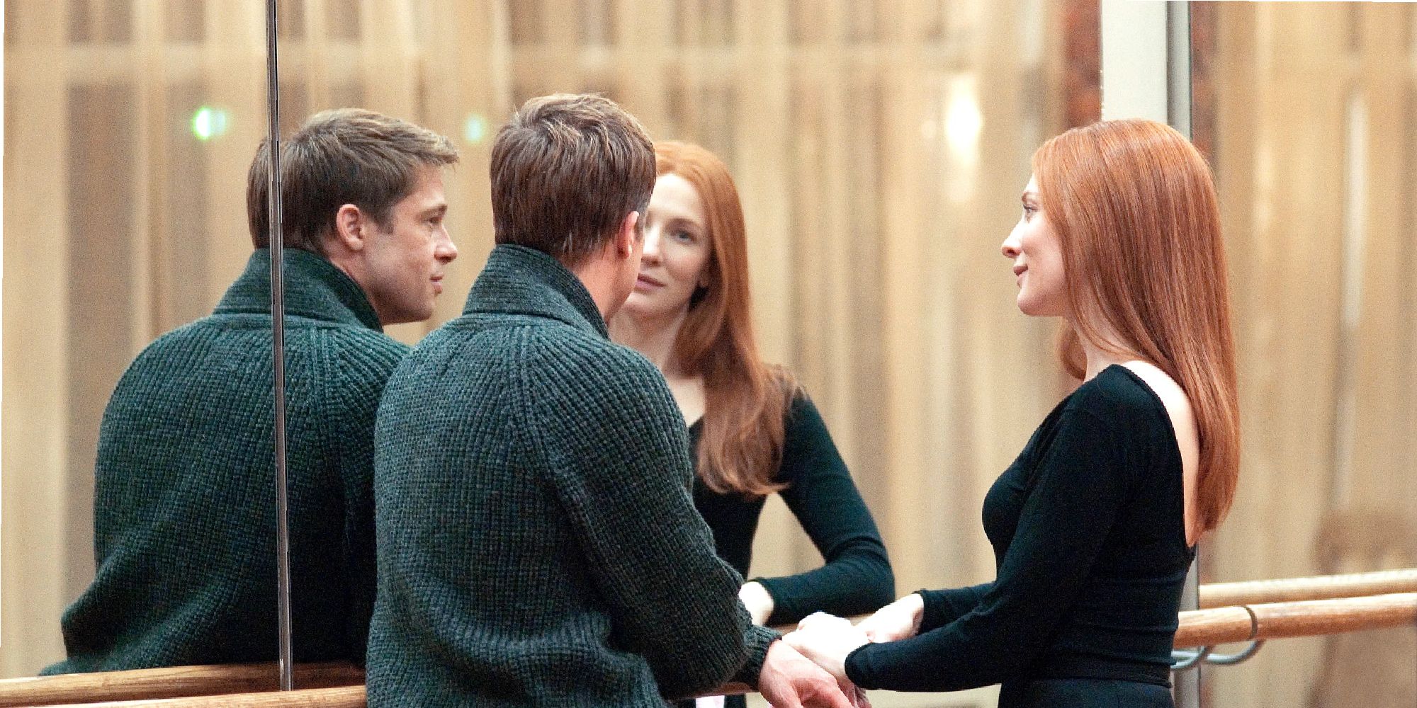 Benjamin and Daisy talking in front of a mirror in The Curious Case of Benjamin Button.