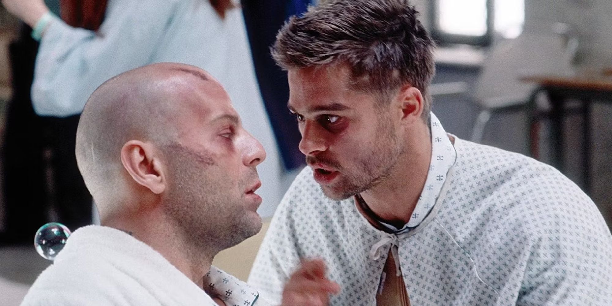 Two patients played by Brad Pitt and Bruce Willis in a mental institution talk to each other in 12 Monkeys.