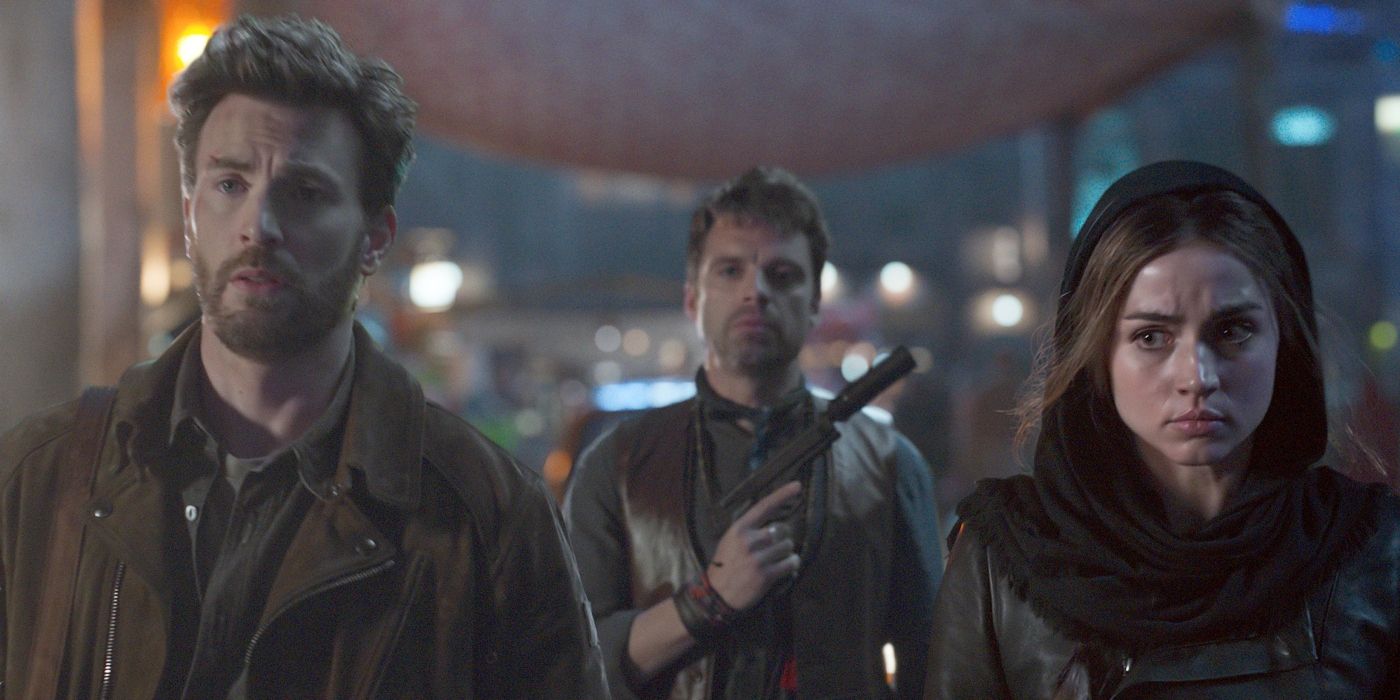 Chris Evans, Sebastian Stan and Ana de Armas in a scene from Ghosted. 