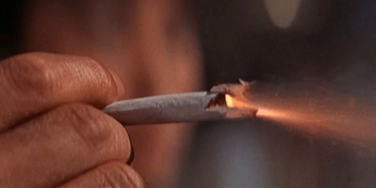 James Bond fires a rocket launcher disguised as a cigarette. 