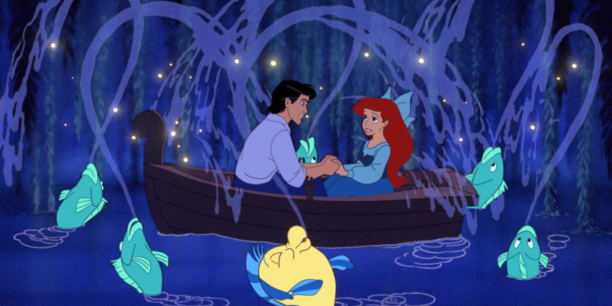 Eric and Ariel holding hands and looking into each other's eyes in a boat during the Kiss the Girl scene in 1989 The Little Mermaid
