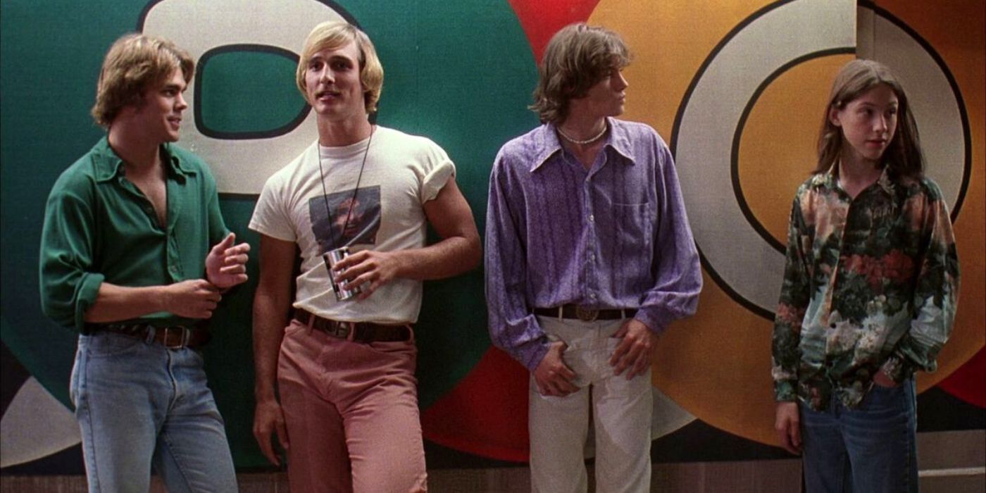 Matthew McConaughey, Sasha Jenson, Jason London, and Wiley Wiggins leaning against a wall in Dazed & Confused