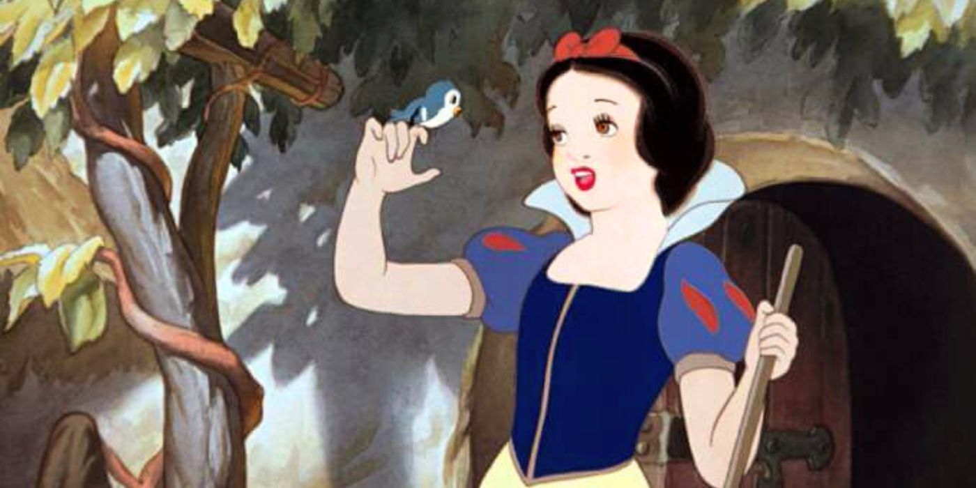 Snow White singing to a bird on her finger in Snow White and the Seven Dwarfs_1937 movie
