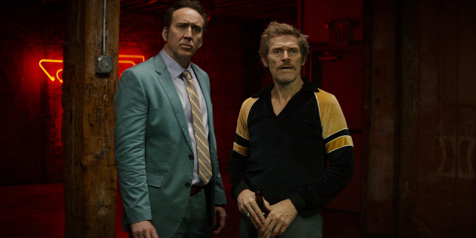 Troy and Mad Dog standing next to each other looking ahead in Dog Eat Dog