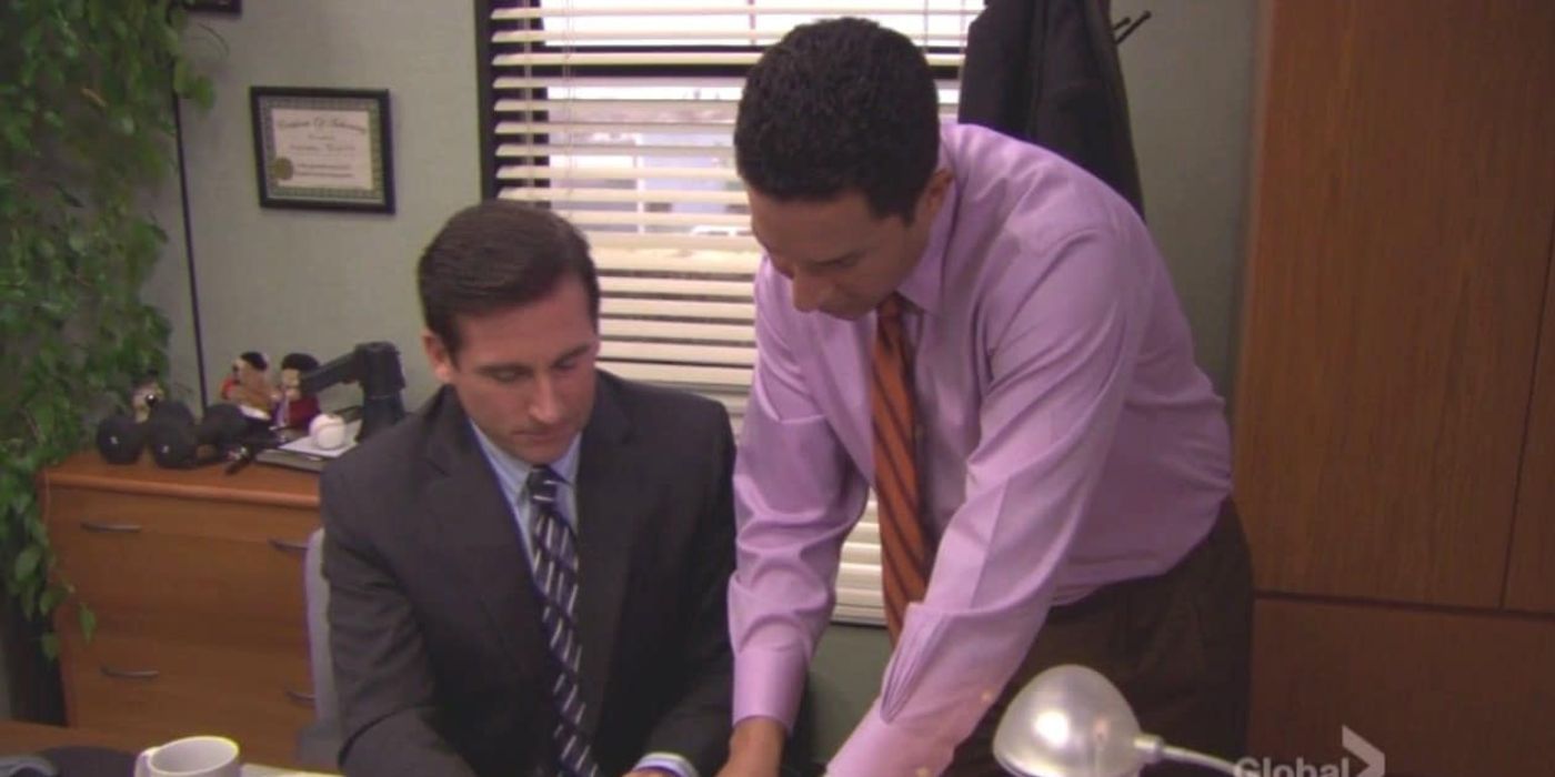 Oscar explaining the surplus to Michael in his office