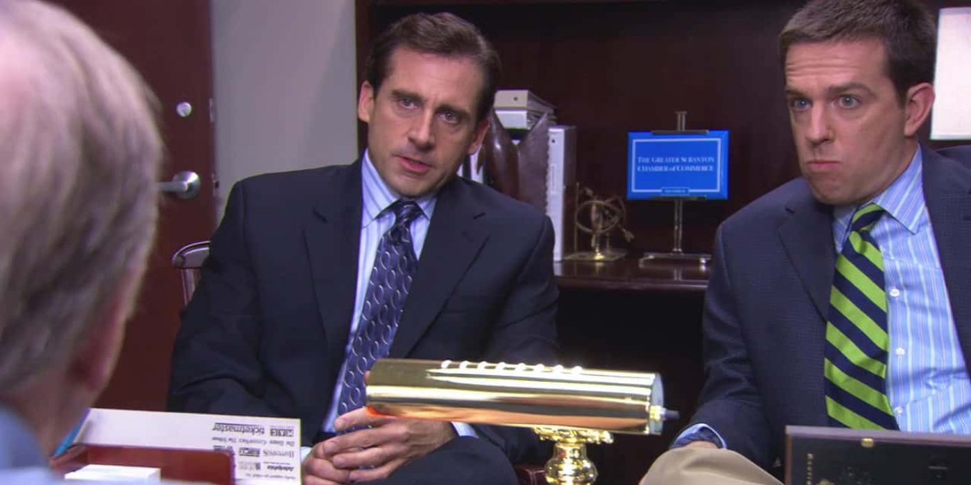 Michael (Steve Carell) and Andy (Ed Helms) sitting in a meeting in The Office