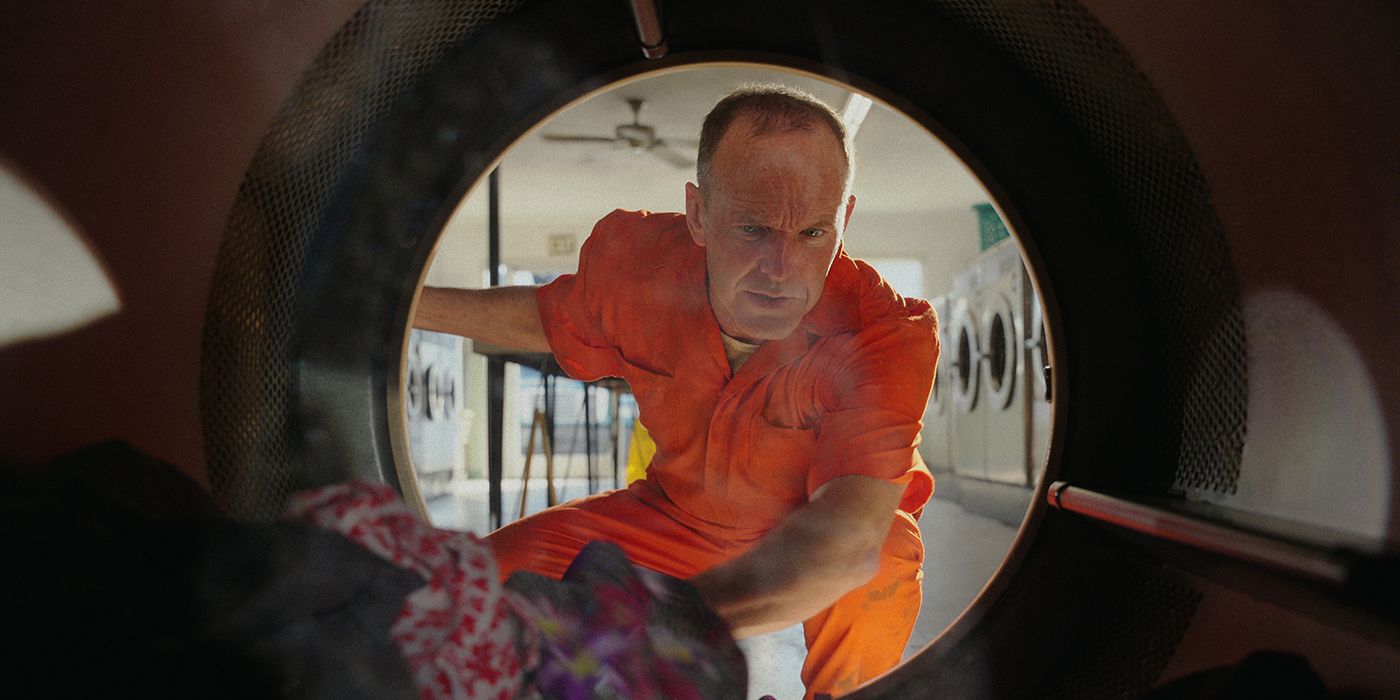 Clark Gregg's character Deputy Ketcher looks for clothes in a scene from Florida Man