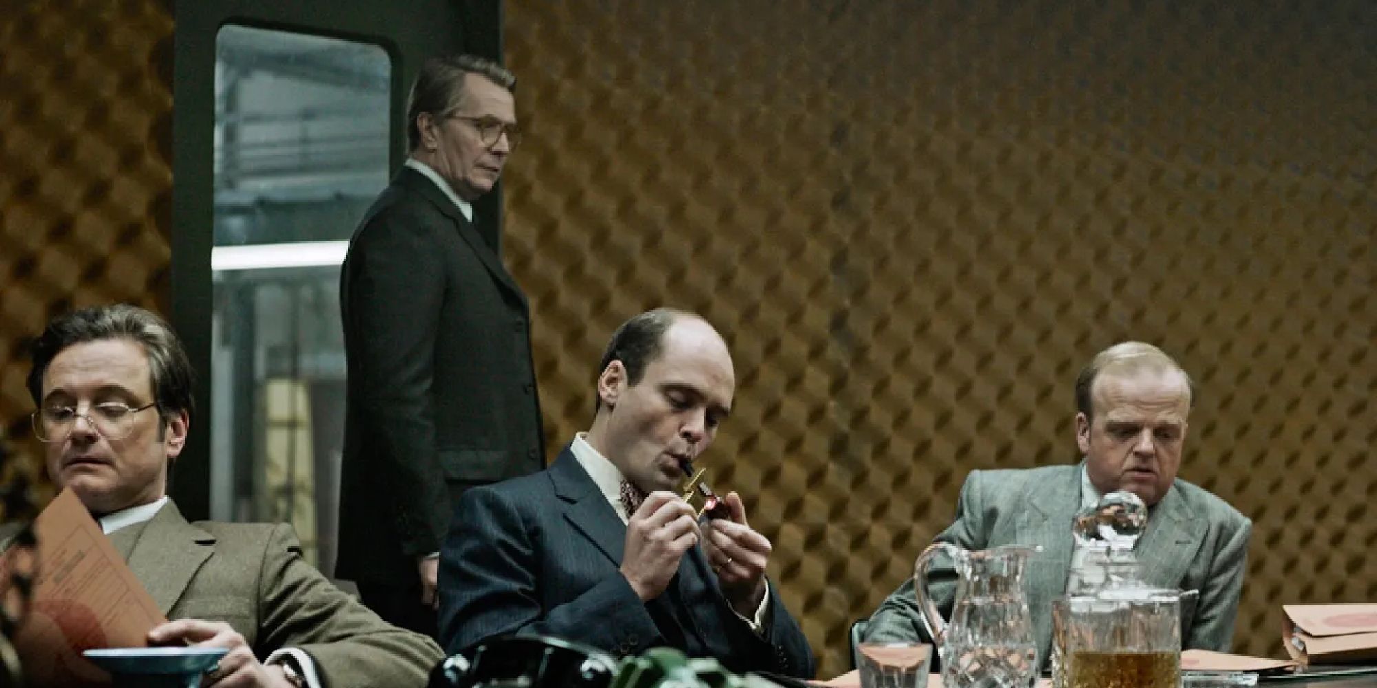 From left to right_ Colin Firth, Gary Oldman, David Dencik, and Toby Jones in Tinker Tailor Soldier Spy