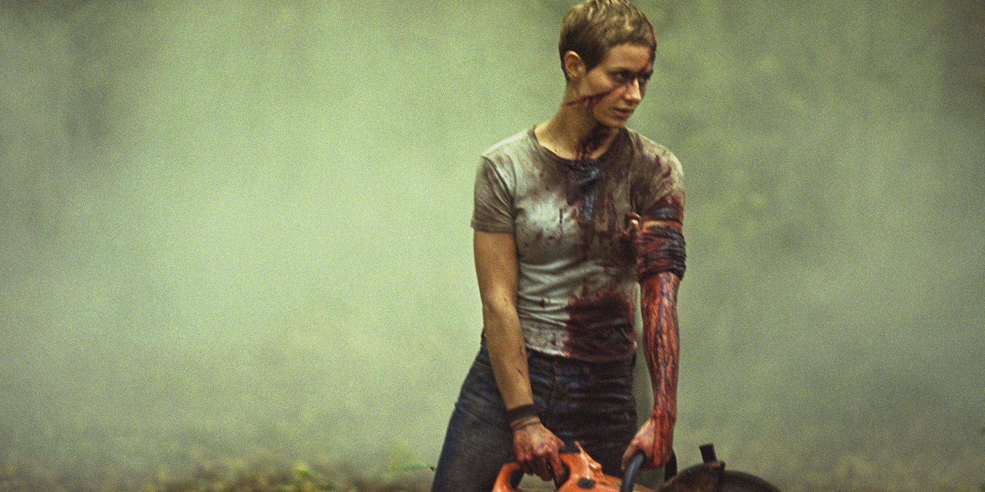 Marie (Cécile de France), covered in blood, holds a chainsaw, in 'High Tension'