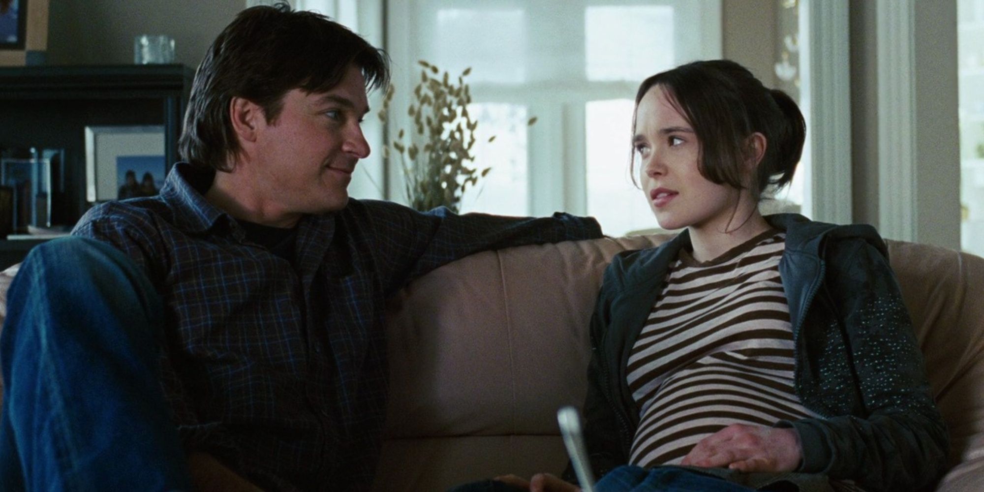 Jason Bateman and Elliot Page as Mark and Juno talking while sitting on the couch in Juno.