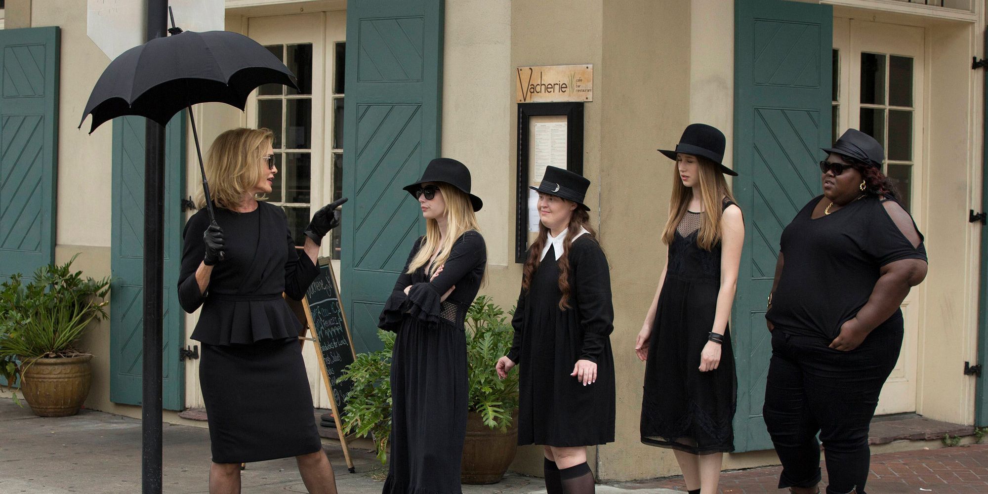 Jessica Lange, Emma Roberts, Gabourey Sidibe, Taissa Farmiga, and Jamie Brewer all dressed in black in American Horror Story