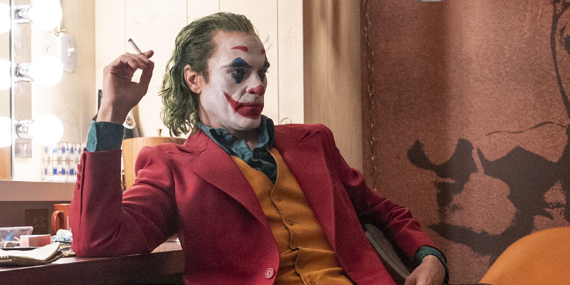 Joaquin Phoenix smoking a cigarette as Joker in Joker