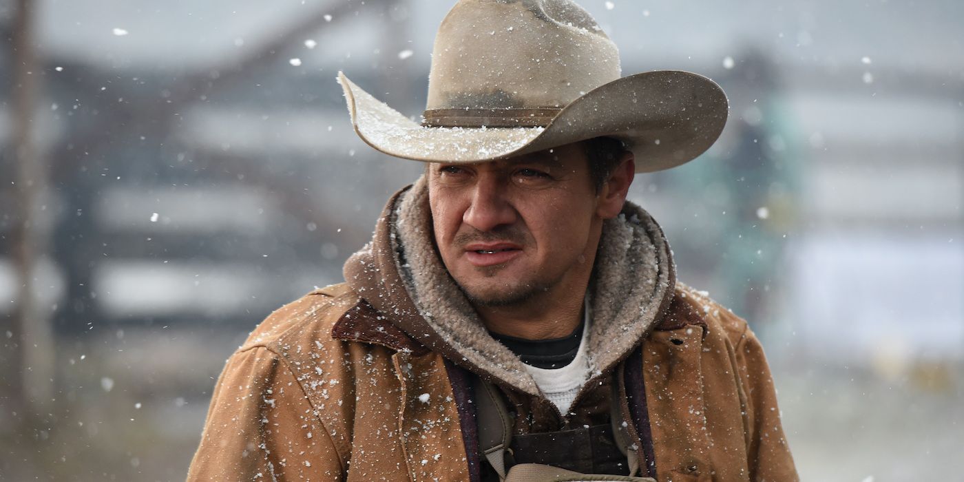 Jeremy Renner as Cory Lambert staring off into the snow in Wind River