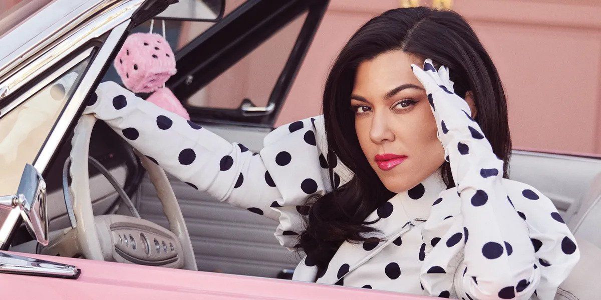 Kourtney Kardashian in a polka dotted shirt 