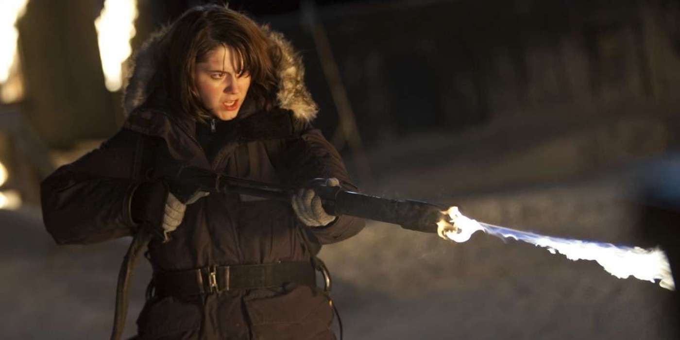 Mary Elizabeth Winstead firing a flamethrower in The Thing (2011)