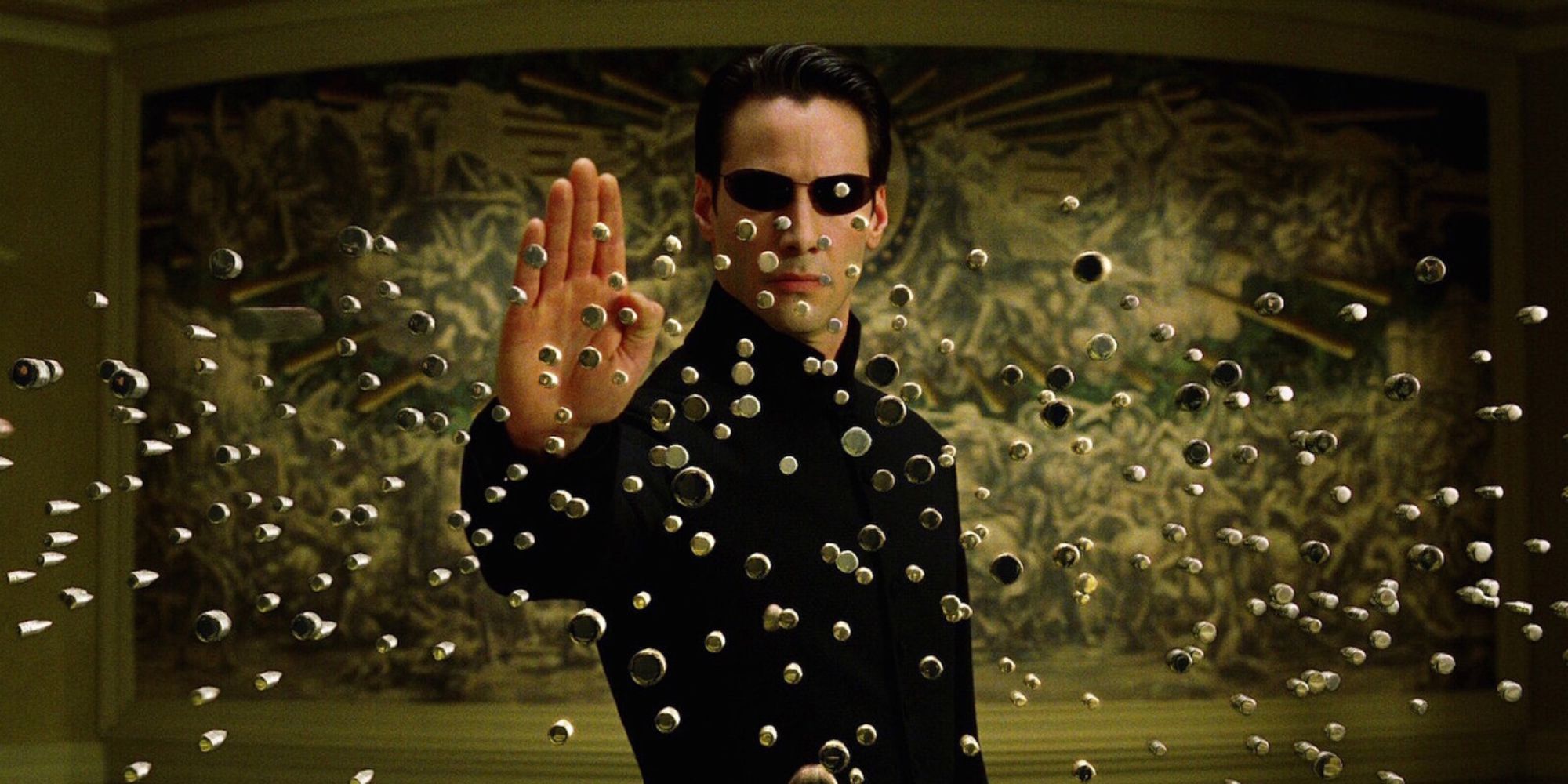 Keanu Reeves as Neo stopping bullets in The Matrix Reloaded (2003)