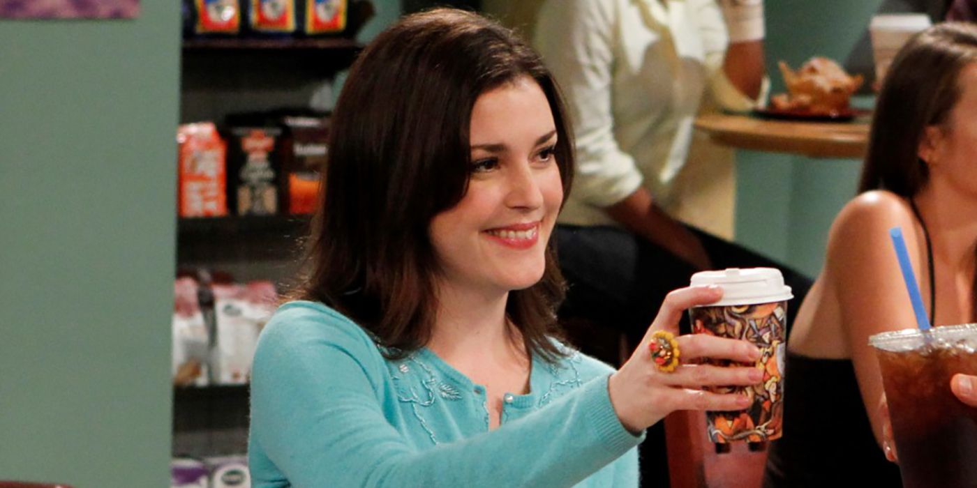 Melanie Lynskey as Rose, smiling and holding up a coffee cup on Two and a Half Men 